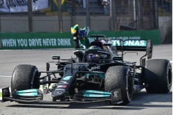 Mercedes F1 W12 E Performance #44 Brazilian GP 2021 (Lewis Hamilton - 1st) holding Brazilian flag
